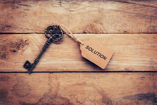 Vintage key with solution tag — unlocking your business potential